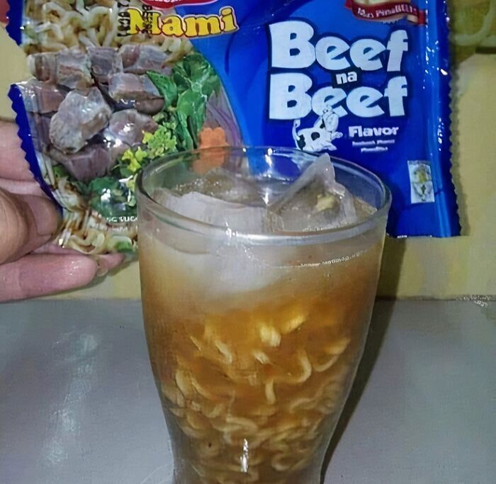 Instant noodles soaked in iced beverage, illustrating unhealthy foods to avoid for physical and mental health.