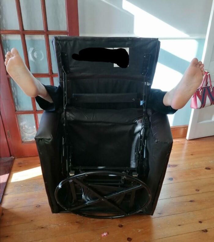 Person stuck upside down under an overturned chair with feet sticking out, funny ways people learned their lesson.