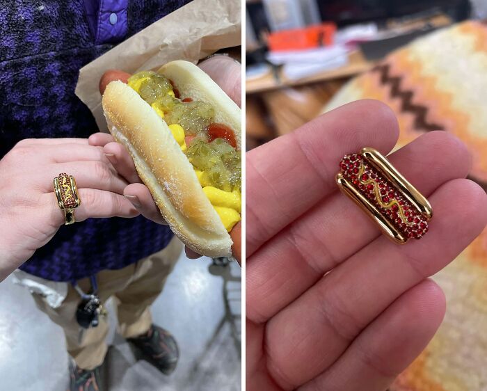 Person wearing and holding a gold hot dog ring, a unique thrift store find with detailed red and yellow accents.