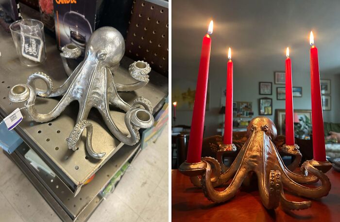 Silver octopus-shaped thrift store candle holder on shelf and lit with red candles on a wooden table.