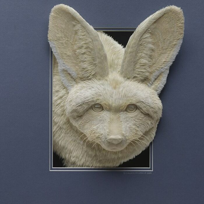 Realistic wildlife sculpture of a fennec fox made from simple paper, showcasing intricate texture and lifelike details.
