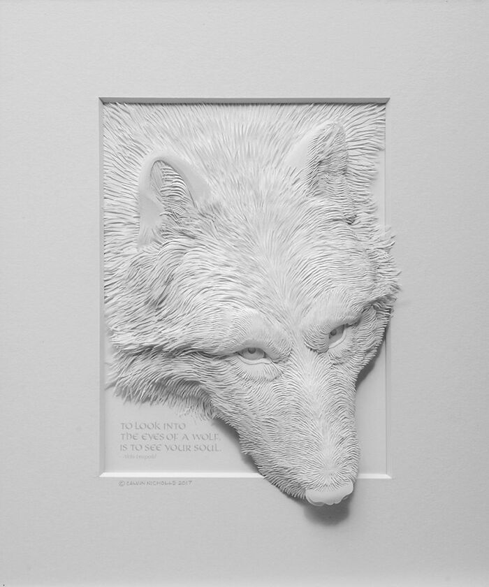 Paper wildlife sculpture of a wolf's head with intricate fur details, showcasing realistic texture and lifelike expression.