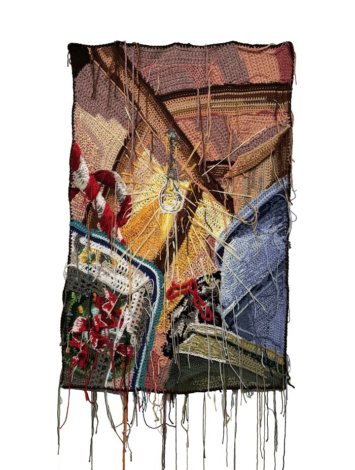 Abstract crochet artwork with various colors and textures showcasing the mastery in crocheting techniques and creative projects.