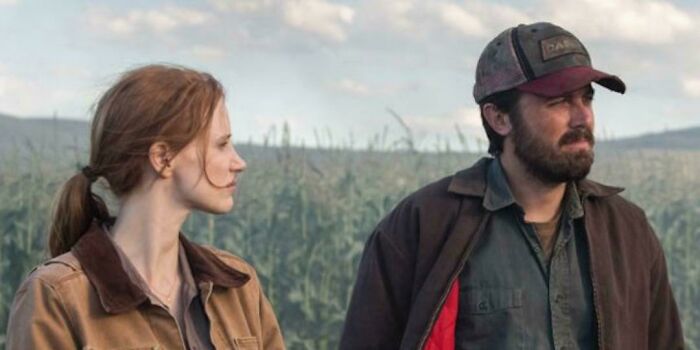 Two people in a field, representing bad movie details discussed by an online group dedicated to confusing film moments.