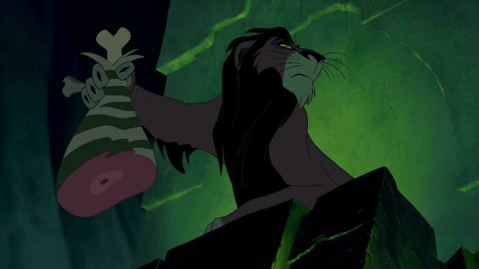 Scar animated villain holding meat in dark setting, illustrating bad movie details in confusing scenes from animated films.