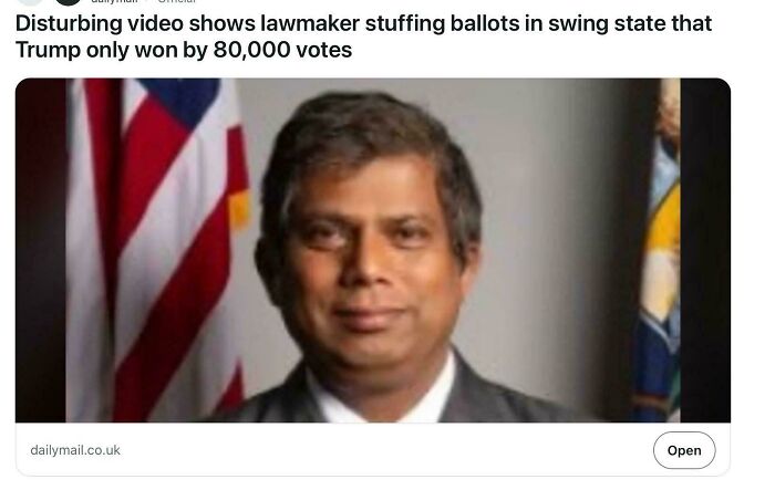 Lawmaker pictured with American flag behind, related to a disturbing video about ballot stuffing attempt exposed.