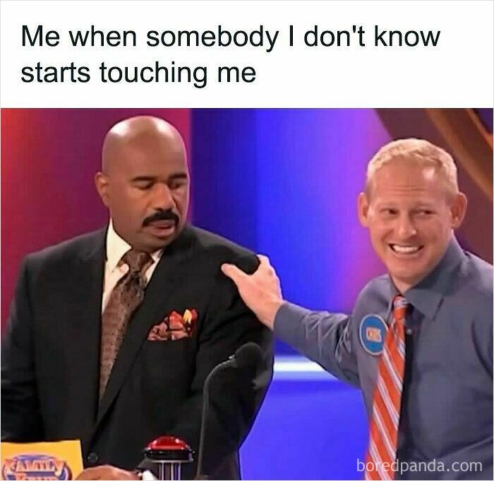 Man in suit looking uncomfortable as another man touches his shoulder, illustrating a hilariously relatable meme moment.