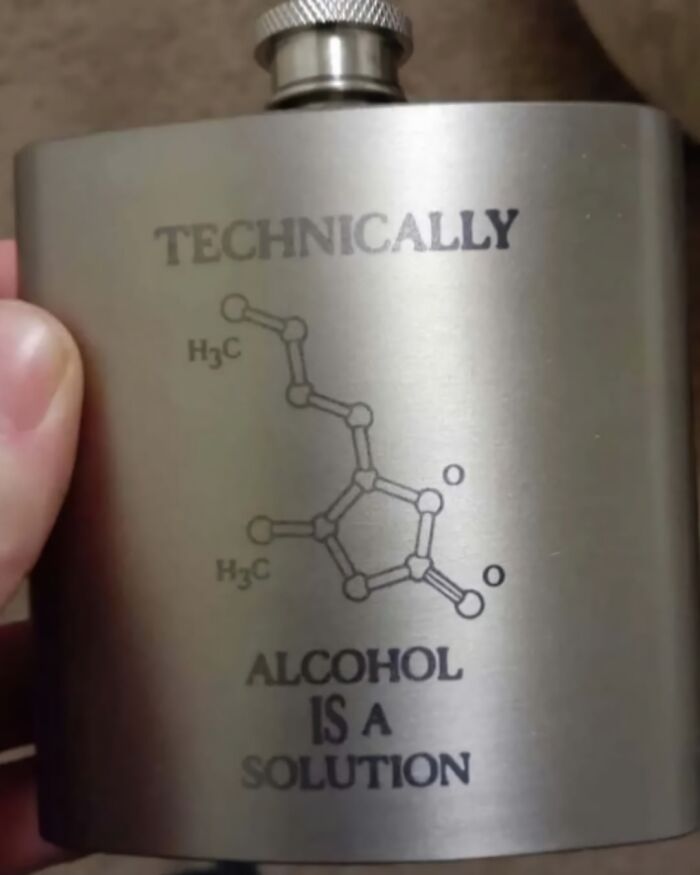 Metal flask with a humorous science meme showing a molecular diagram and text about alcohol as a solution, science memes theme.