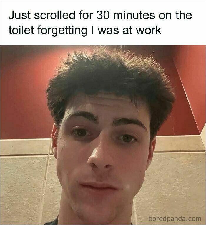 Young man with messy hair in a bathroom, illustrating relatable memes about distractions and feeling called out at work.