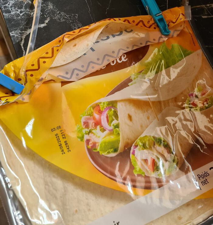 Packaged tortillas secured with clips on a marble countertop, part of 68 people who wish they didn’t have a sibling photos.