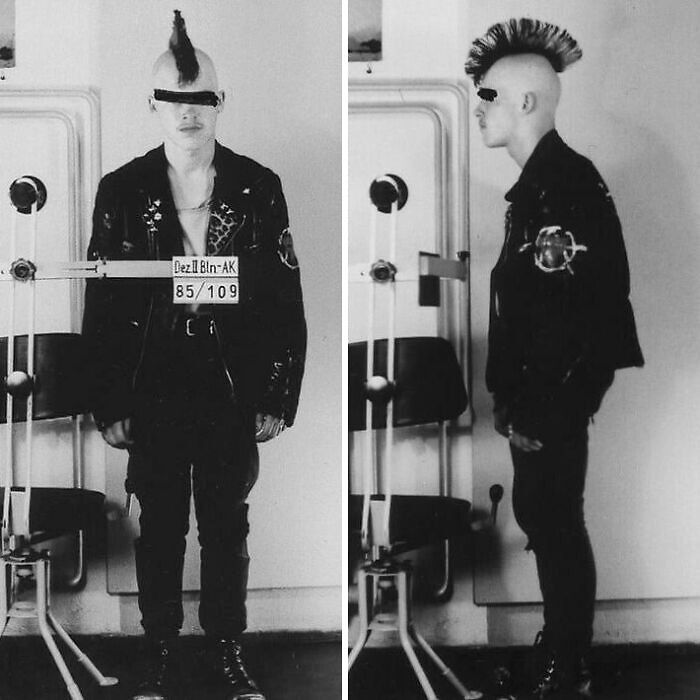 Black-and-white mugshot of a punk with a mohawk, showing how common folk made a huge mark in society and history.