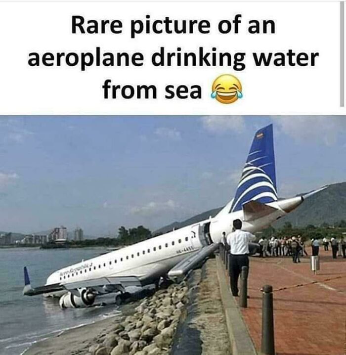 Airplane partly in water and on rocky shore, illustrating a parking fail by being improperly parked near the sea.
