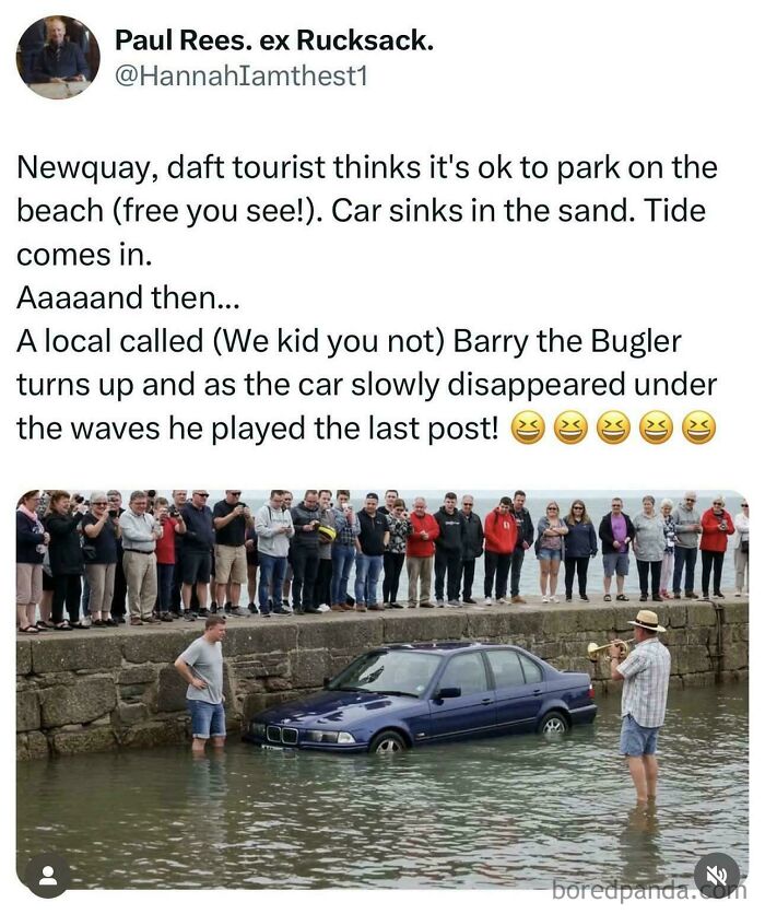 Crowd watches as a car sinks in water after parking fail, with a man playing trumpet nearby in this parking fail scene.