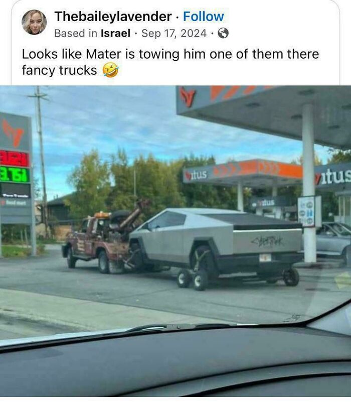 Tow truck towing a futuristic vehicle at a gas station, capturing one of the most unusual parking fails shared online.