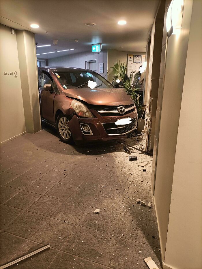Car crash inside a building causing severe damage, illustrating a major parking fail shared online.