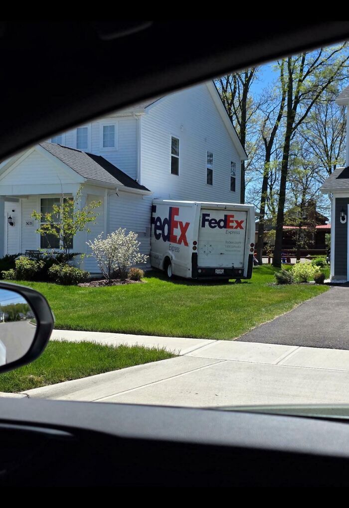 FedEx delivery truck parked on residential lawn showing one of many parking fails shared online.