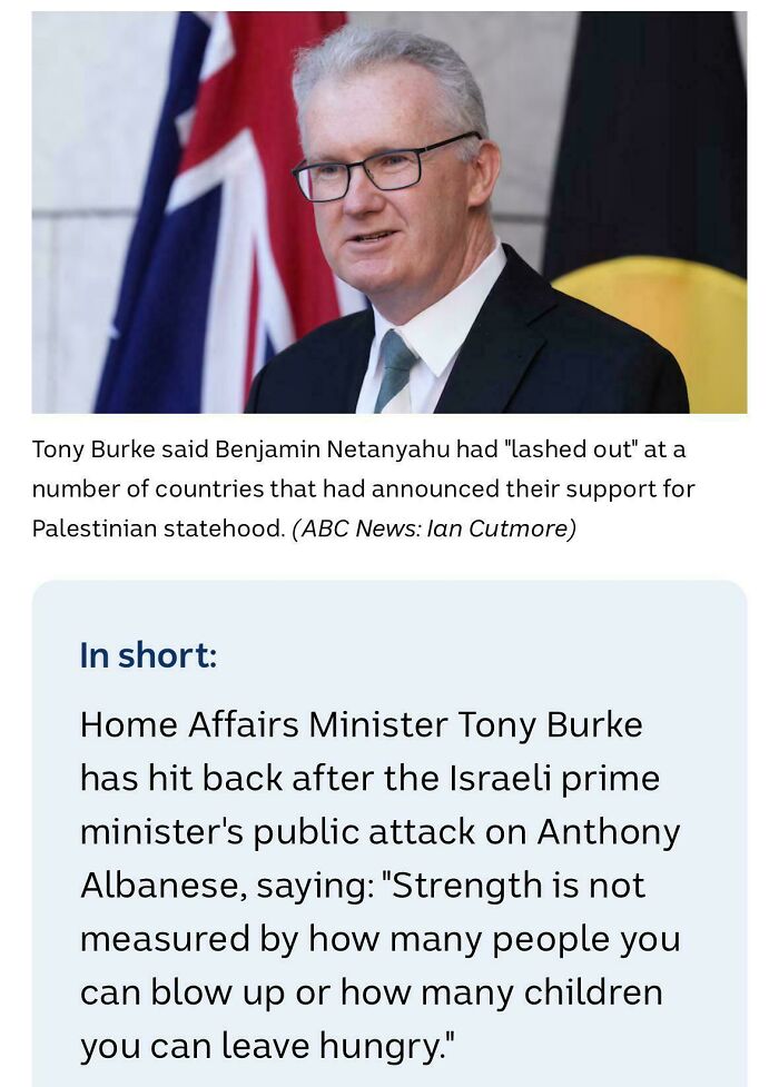 Man in suit and glasses speaking in front of flags, illustrating moments when there was an attempt but the universe had different plans.