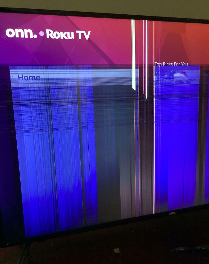 Damaged TV screen showing distorted vertical and horizontal lines, illustrating sibling shenanigans causing screen breakage.