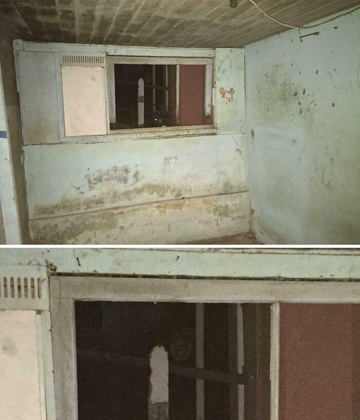 Dilapidated room with peeling walls and a creepy dark figure behind a small window, capturing unsettling moments.