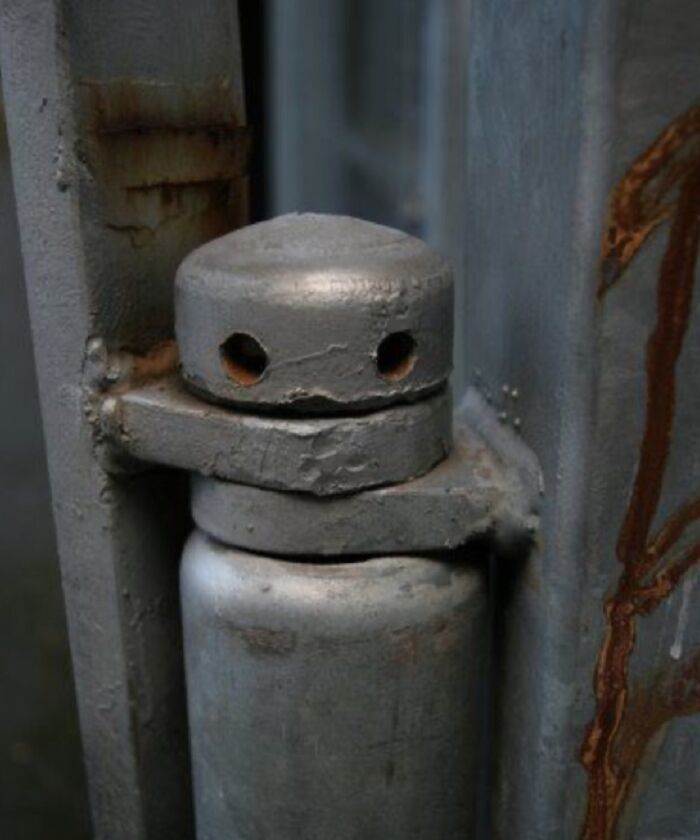 Close-up of a random object on metal structure that looks like a face, posted by members of a face-looking objects Facebook group.