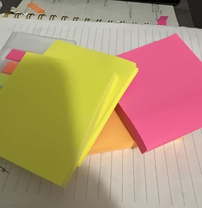 Colorful sticky notes and tabs arranged on a notebook, perfect back to school finds for organizing and planning.
