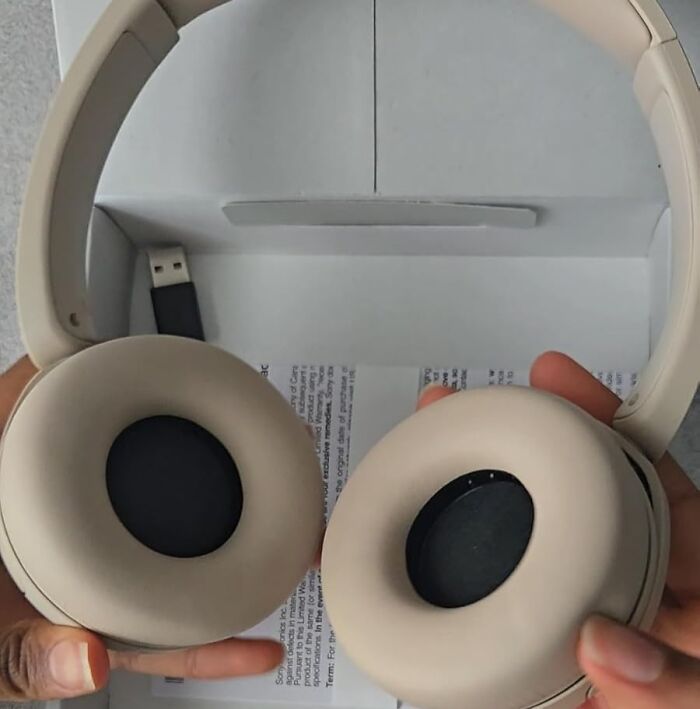 Beige wireless headphones with cushioned ear pads and a USB charging cable, a top back to school find.