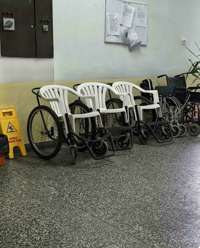 Wheelchair made using plastic chairs and bicycle wheels, showcasing creative redneck engineering ingenuity and practical design.