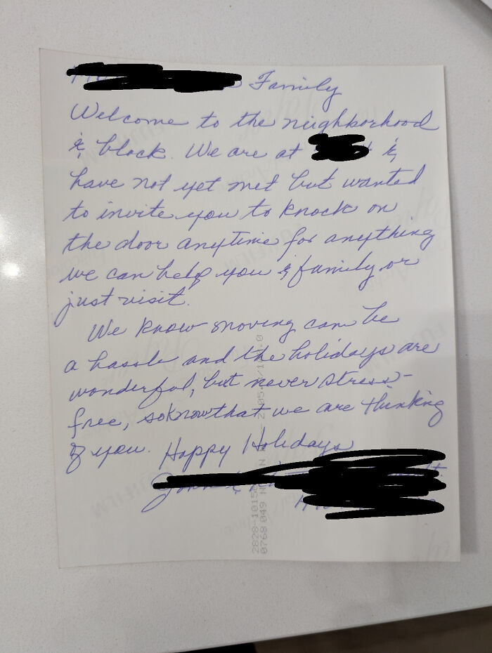 Handwritten note from wholesome kind neighbors offering help and holiday wishes to new family in the neighborhood.