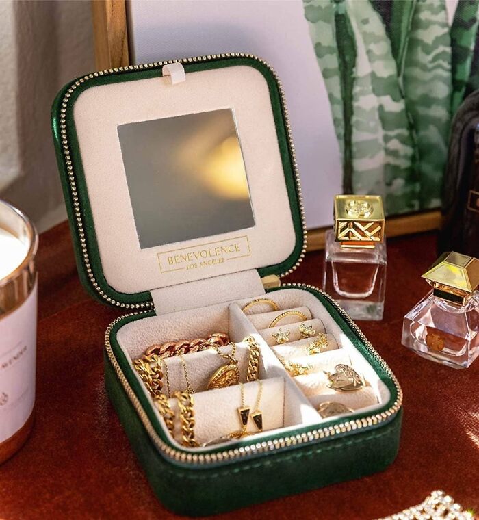 Compact travel jewelry case with gold accessories, ideal for travel finds for people who are chronically bad at packing.