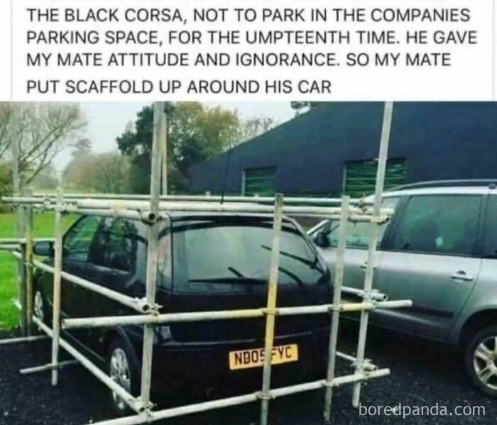 Black car surrounded by scaffolding after owner repeatedly parked in a restricted spot, illustrating a major parking fail.