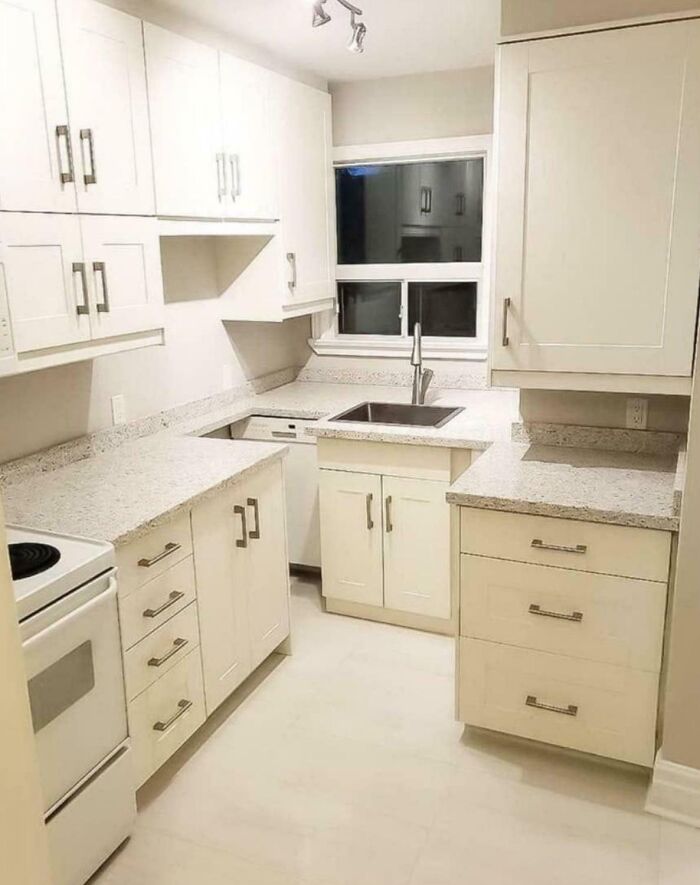Small kitchen with DIY disaster countertops that block dishwasher and sink usability, showcasing a notable DIY mistake.