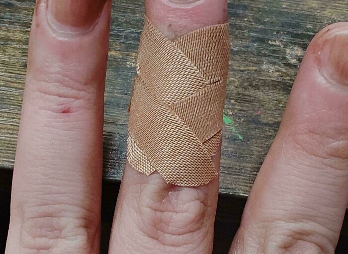 Close-up of a finger with a creative bandage wrap demonstrating one of the most genius life hacks people actually use.