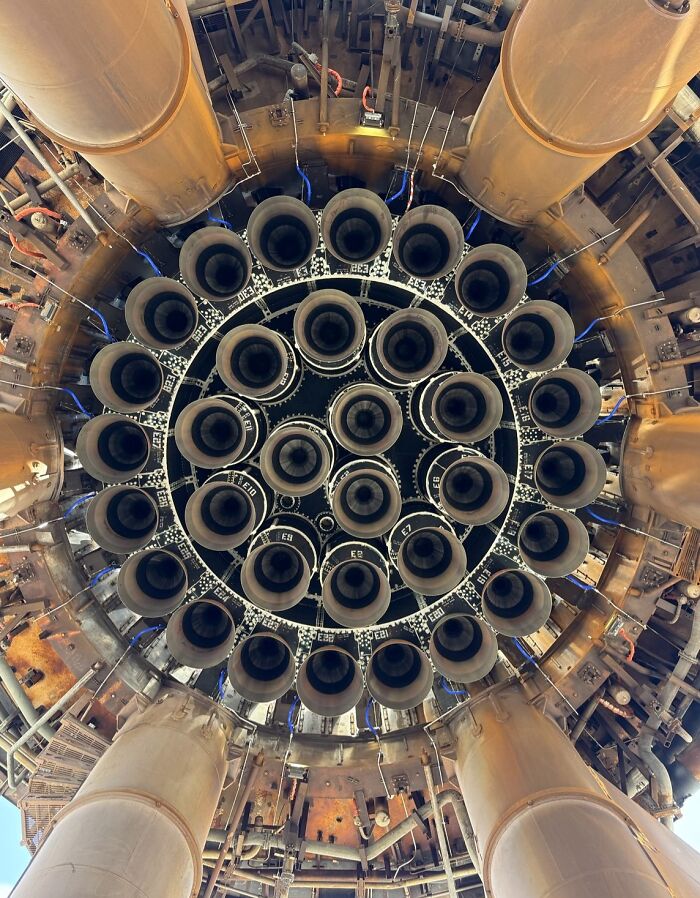 Rocket engine nozzles arranged in a circular pattern, creating a creepy and unsettling moment captured up close.
