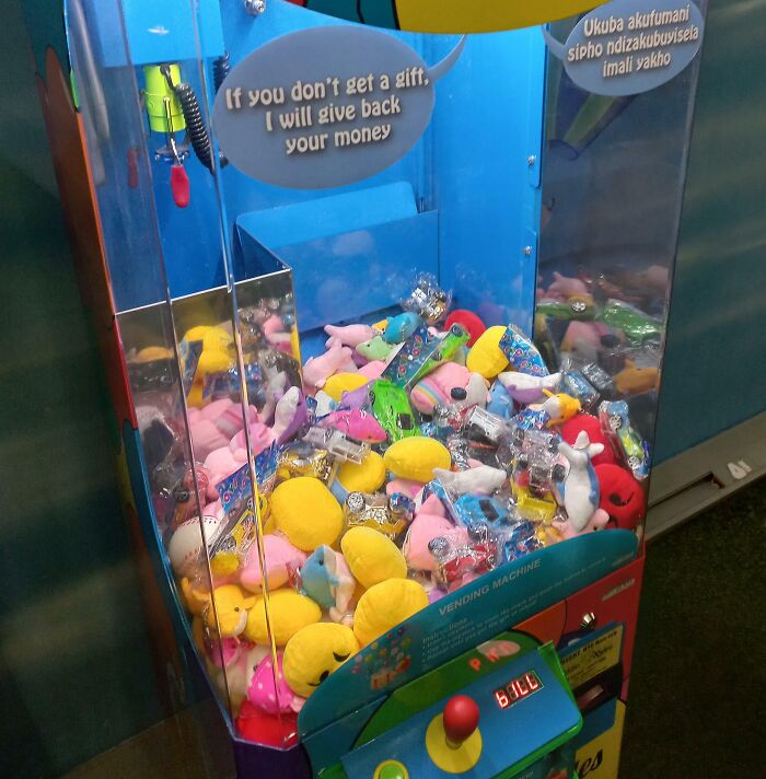 Creative claw machine filled with colorful plush toys showcasing unique entertainment at bars and restaurants worldwide