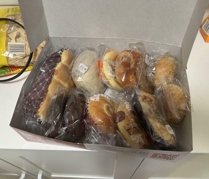 Assorted packaged baked goods in a box, ready to share with wholesome kind neighbors as a thoughtful gesture.