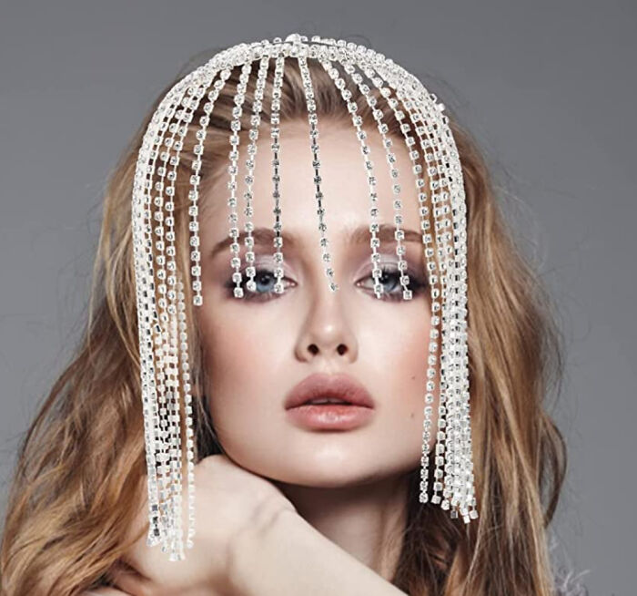 Woman with distorted crystal headpiece Photoshop fail showing obvious digital editing errors on a portrait image