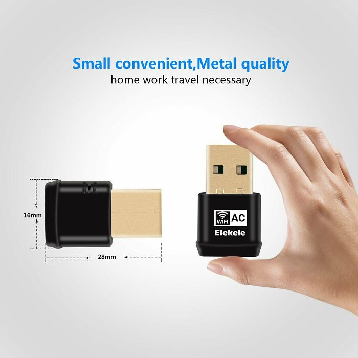 Hand holding a small USB WiFi adapter with metal quality, illustrating one of the notable Photoshop fails.