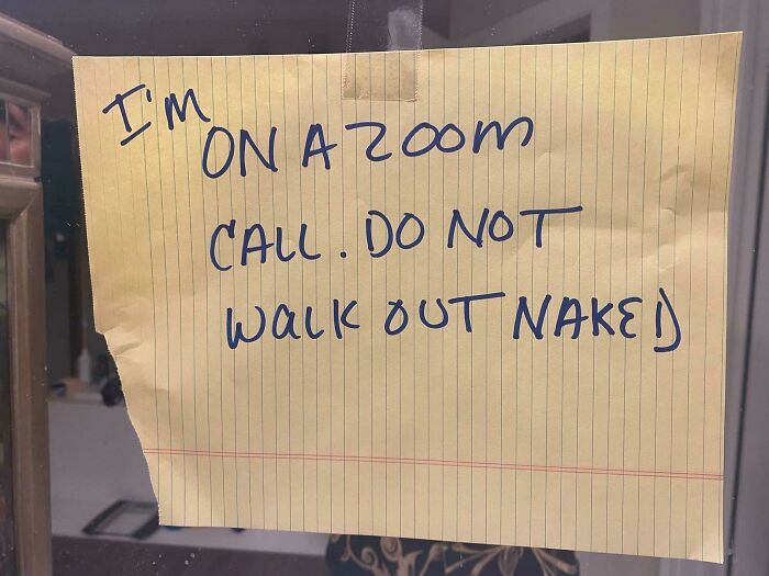 Handwritten humorous note on lined paper warns not to walk out naked during a Zoom call, showing random funny messages.