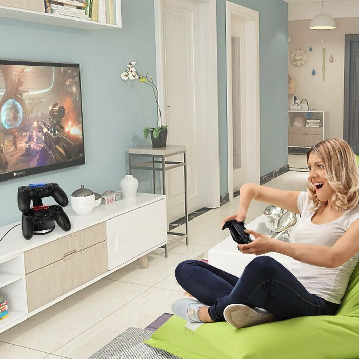 Woman playing video games with an oddly edited arm, illustrating some of the worst Photoshop fails visible in the image.