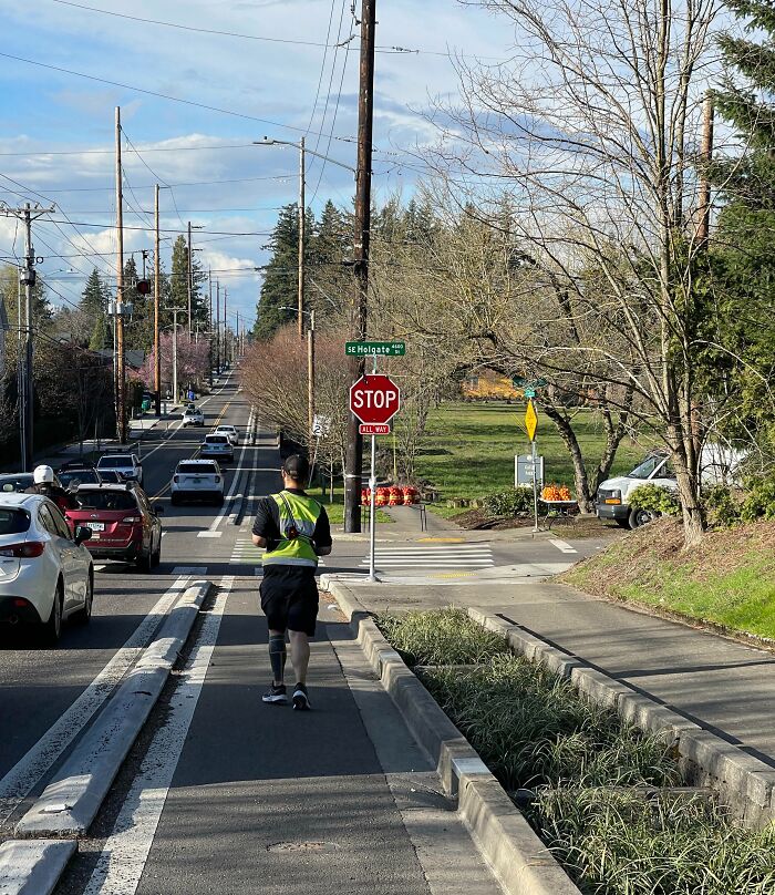 Man walking on a busy street sidewalk, illustrating selfish people causing inconvenience and making life harder for others.