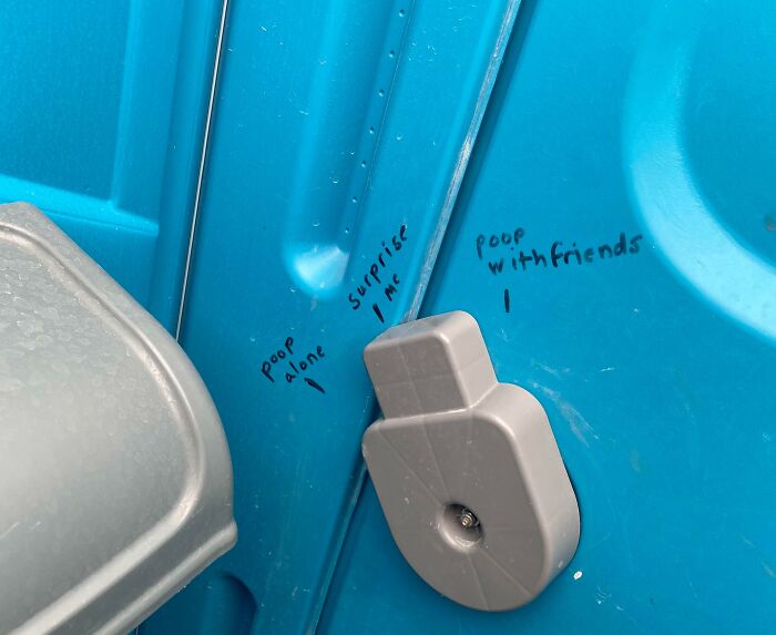 Graffiti with hilariously random notes inside a blue portable toilet reminding us not to take life seriously.