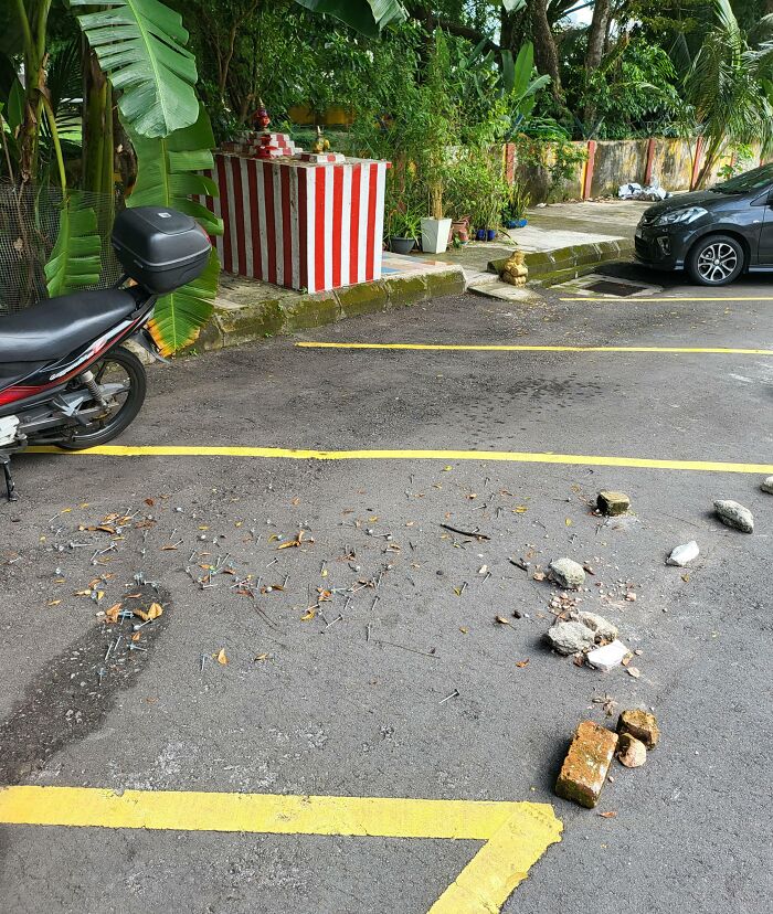 Parking spot filled with nails and rocks showing selfish people lost common decency making life harder for others