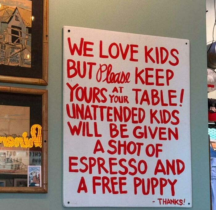 Funny sign humorously reminding to keep kids at their table with a shot of espresso and a free puppy offer.