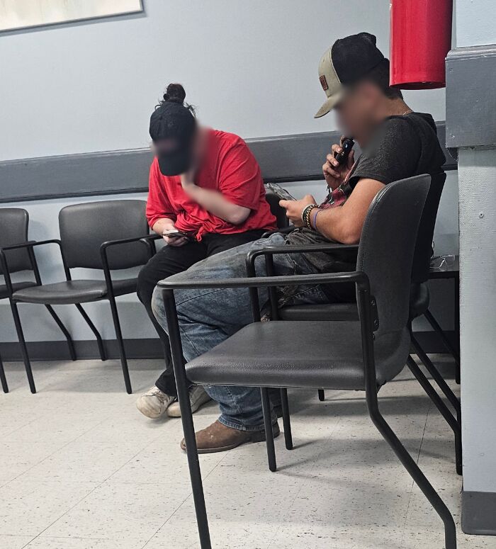 Two people ignoring an empty waiting room, showing selfish behavior and lack of common decency in a public space.