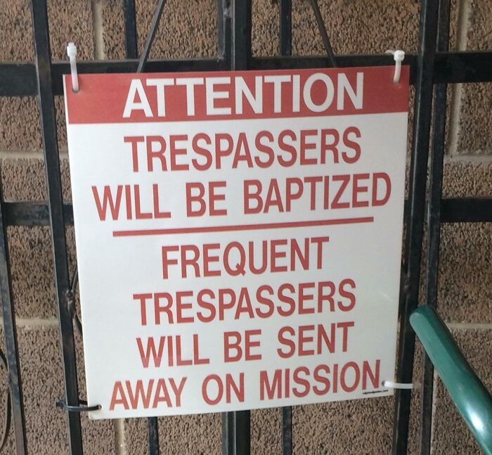 Funny warning sign about trespassers being baptized or sent away, illustrating hilarious random notes and messages.
