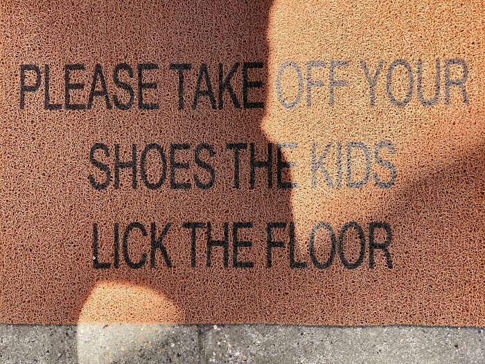 Doormat with a funny message about shoes and kids, part of hilariously random notes and signs reminding us to relax.