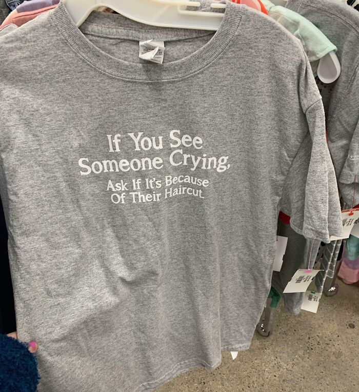 Grey t-shirt with a humorous sign reminding us not to take life too seriously with funny random messages.