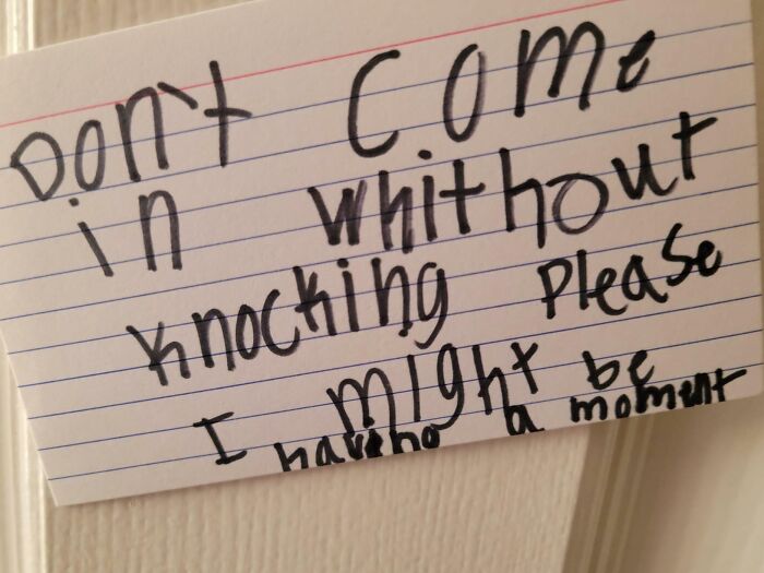Handwritten funny note on lined paper reminding not to come in without knocking, showcasing random humorous messages.