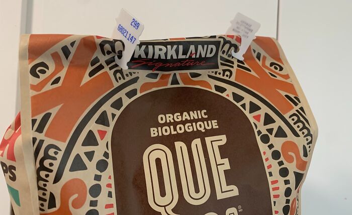 Reusable bag clip holding a Kirkland Signature organic coffee bag, demonstrating genius life hacks people actually use.