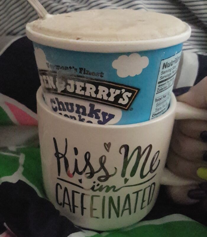 Ice cream container placed inside a coffee mug showing a genius life hack for keeping treats cold and accessible.
